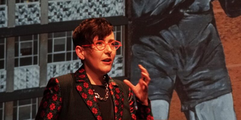 Alywyn Walsh speaking at a lecturn