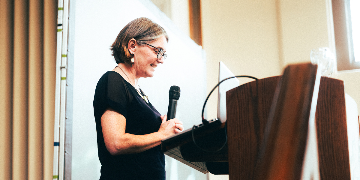 Professor Louise Waite talking at a lectern