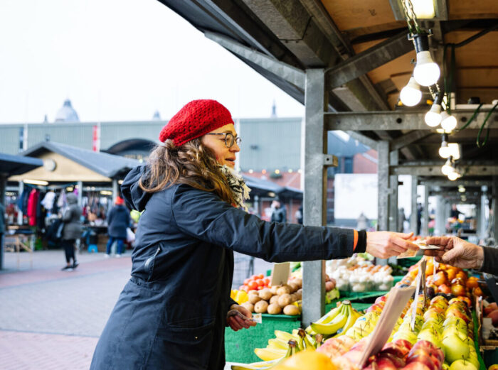 Sara Gonzalez buying fruit at Leeds Market